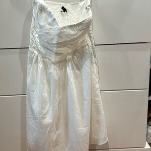 White sweetheart shaped strapless summer dress.